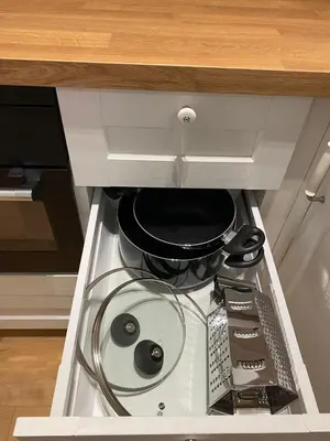 a stove with a pot and pans in a kitchen at Sokolska apartment in Prague