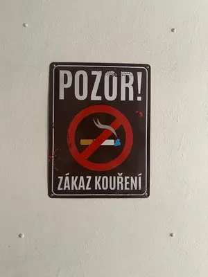 a sign on a ceiling with a no smoking sign at 1920s Charm apartment by Jerusalem Synagogue in Old Town Center in Prague