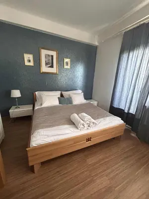 a bedroom with a large bed in a room at Affordable Top floor 2BR nightlife location in Center and yet Quite Sleep in Prague