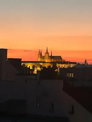 a view of a city at sunset with a building at Affordable Top floor 2BR nightlife location in Center and yet Quite Sleep in Prague
