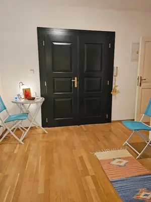a room with a black door and two chairs and a table at 2 min Center Just In, Old Town Walk private room B in Prague