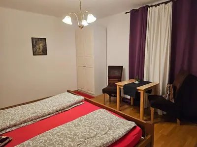a bedroom with two beds and a table and a chair at 2 min Center Just In, Old Town Walk private room C in Prague