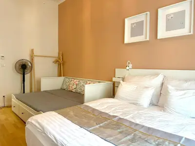 a bathroom with a shower and a toilet and a sink at Golden Dome Skyline Retreat Modern 2BR Apartment in Prague 1 Center with King Bed and Museum View in Prague