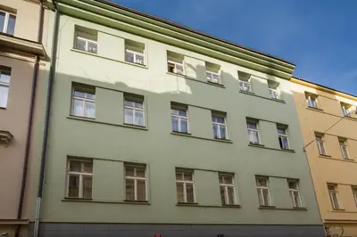 a building with windows on the side of it at Quaint Trendy Apartment in Prague