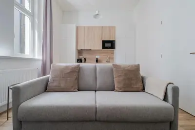 a bedroom with a white bed and two windows at Blueground Holešovice city view nr Vltava PRG-53 in Prague