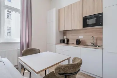 a living room with a couch and a table at Blueground Holešovice city view nr Vltava PRG-53 in Prague