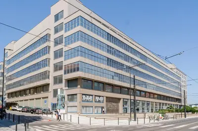 an office building with a street in front of it at Blueground Holešovice view nr Vltava PRG-52 in Prague