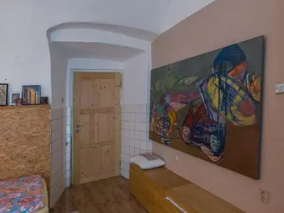 a room with a large painting on the wall at Very old house Ptice in Ptice