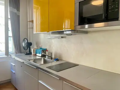 a kitchen with a sink and a microwave at Prague apartment in Centre city in Prague