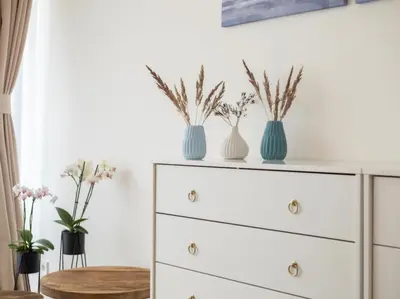 an empty room with white cabinets and a hallway at Holesovice Luxury Apartments in Prague