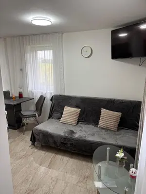 a living room with a couch and a table at Countryside Apartments 252 in Poříčí nad Sázavou