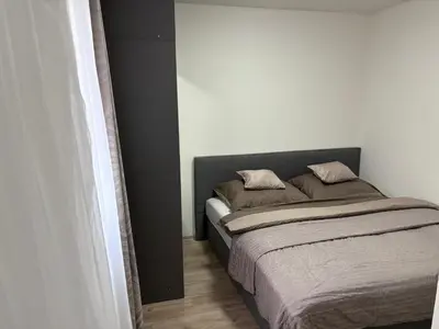 a bedroom with a bed with two pillows on it at Countryside Apartments 252 in Poříčí nad Sázavou
