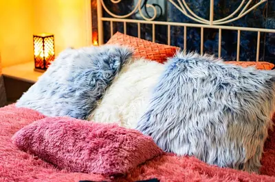 a bed with two pillows on top of it at Bohemian Emperors Residence in Prague