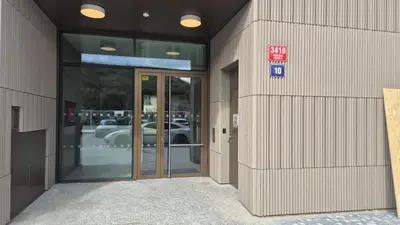 an entrance to a building with a glass door at Smichov Luxury Apartments Residence Madeleine in Prague