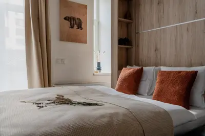 a bedroom with a bed with orange pillows at Apartment Dalimilova in Prague