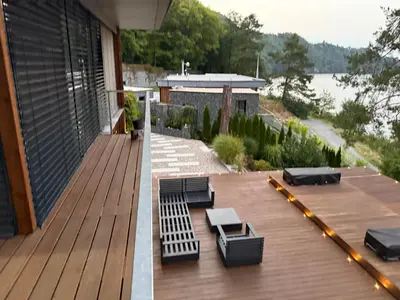 two pictures of a deck with benches on a house at Hrdlička Slapy Chalot in Buš