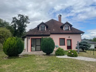 a small pink house with a brown roof at Rodinný dům Divišov u Benešova, Na Spravedlnosti 276 in Vlašim