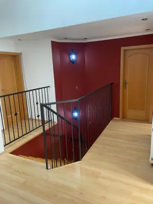 an empty room with a staircase with red walls at Rodinný dům Divišov u Benešova, Na Spravedlnosti 276 in Vlašim