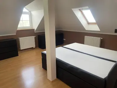 a bedroom with a bed and two windows at Rodinný dům Divišov u Benešova, Na Spravedlnosti 276 in Vlašim