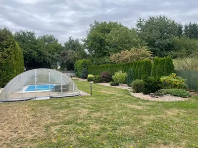 a greenhouse in a yard with a swimming pool at Rodinný dům Divišov u Benešova, Na Spravedlnosti 276 in Vlašim