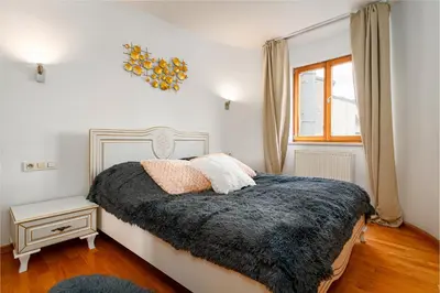 a bedroom with a bed and a window at Bright Bohemian River in Prague