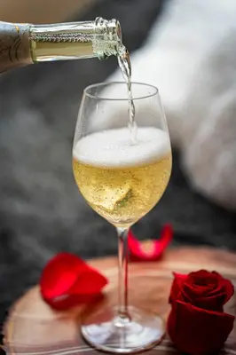 a glass of wine being poured into a wine glass at Bright Bohemian River in Prague