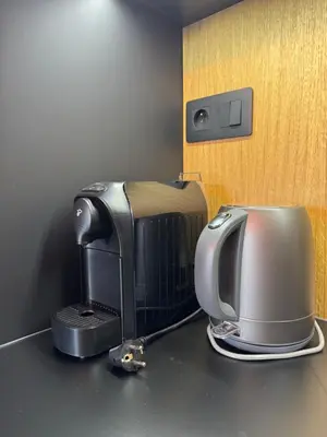 a coffee maker and toaster sitting on a counter at Slapy One&Only in Buš