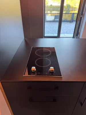 a counter top with a stove on top of it at Slapy One&Only in Buš