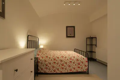 a bedroom with a bed and a dresser at New spacious apartment for 6 people, direct entrance in Prague