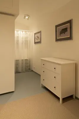 an empty room with a dresser and a bedroom at New spacious apartment for 6 people, direct entrance in Prague