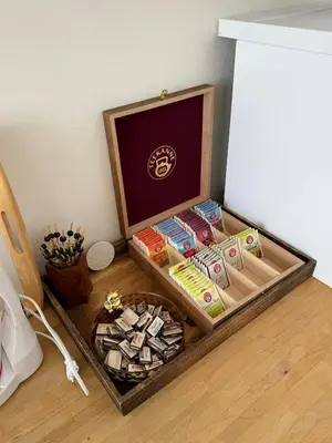 a wooden box filled with different types of ties at CUBE Apt in Prague center in Prague