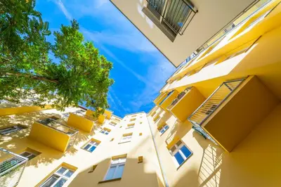 an image of a building looking up at the sky at De Luxe Suite with balcony in Angelo Residence by Rentez in Prague