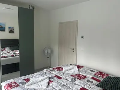 a bedroom with a bed with pillows on it at Holiday Home Prague Šeberov in Prague