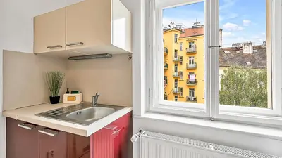 a kitchen with a sink and a window at Stylish Apartment near Wenceslas Square in Prague