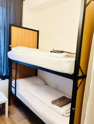 a dorm room with two bunk beds in it at Levné ubytování in Prague