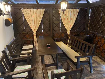 a room with a table and chairs in a yurt at Chalupa u Marušky