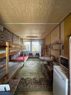 a room with two bunk beds and a desk at Chatka Nová Živohošť in Křečovice