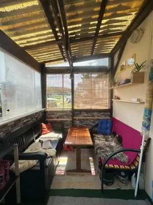 a living room with a couch and a table at Chatka Nová Živohošť in Křečovice