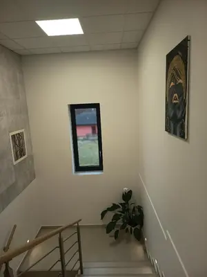 a staircase in a building with a potted plant at Apartmány MB JARO Mladá Boleslav in Bradlec