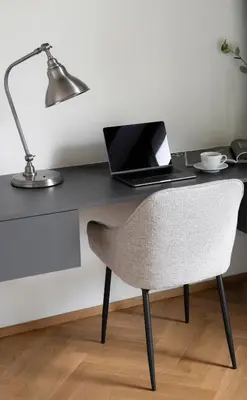 a desk with a laptop computer and a chair at Luxury Oomph Apartments in Prague