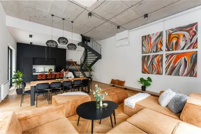 a living room with a couch and a table at Luxury Oomph Apartments in Prague