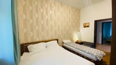 a bedroom with a bed and a window and a bed sidx sidx sidx at Emperor apartment in centre in Prague