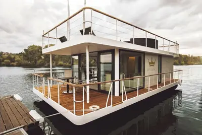 a large boat is docked on the water at VIPliving Houseboat in Prague