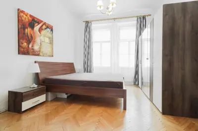 a bedroom with a bed and a window at Prague central 3&kk apartment Andel in Prague