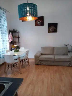 a living room with a couch and a table at Prague central 3&kk apartment Andel in Prague