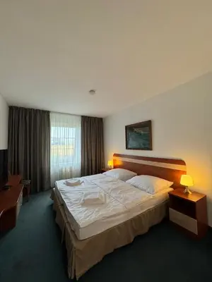 a bedroom with a large bed in a room at Park Pension