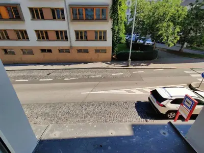 a car parked on the side of a street with a building at Comfy 2 Bedrooms Flat 4 persons & Parking in Prague