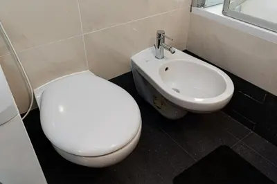 a bathroom with a toilet and a sink at Brilliant Rabbit Residence in Prague