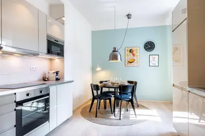a kitchen with a table and chairs in a room at Cozy Apartment near The Old Town Square in Prague