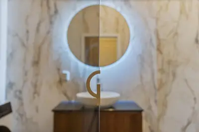 a bathroom with a sink and a mirror at Design Apartment in the heart of Old Town Prague in Prague